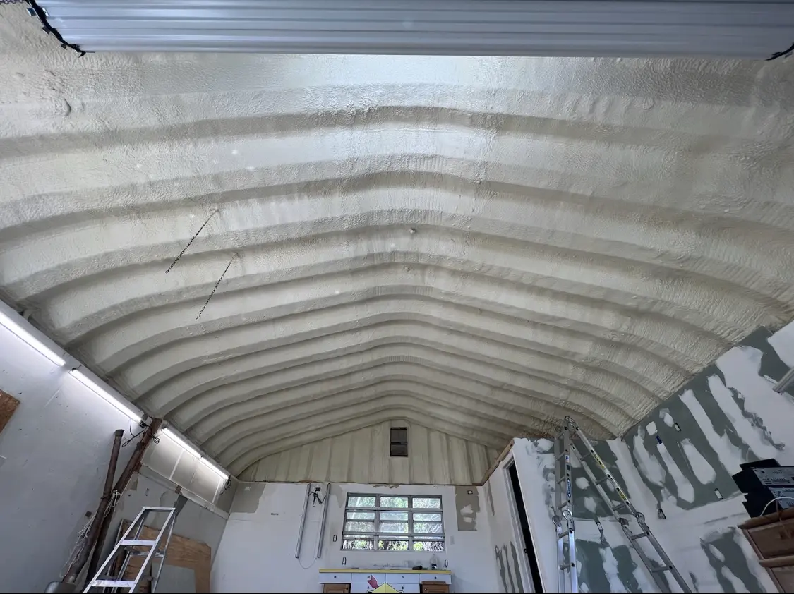 Spray polyurethane foam applied to the underside of a metal roof deck in North Salem